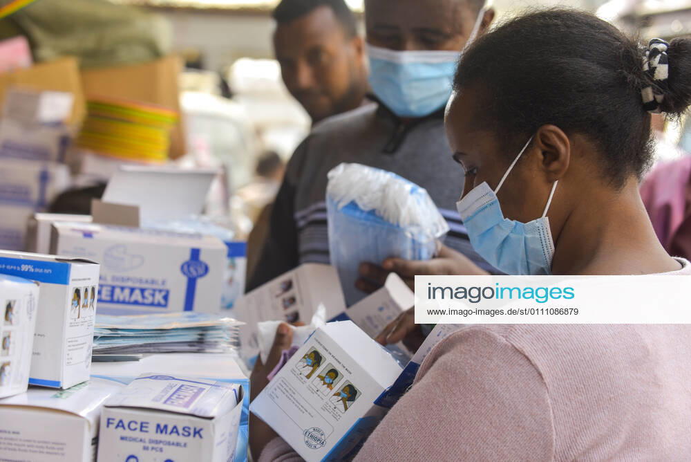 (210127) -- BEIJING, Jan. 27, 2021 -- A woman selects face masks at an open-air market in Addis Ababa, Ethiopia, Jan. 9, 2021. TO GO WITH XINHUA HEADLINES OF JAN. 27, 2021 ) WORLD-COVID-19-TOTAL CASES MichaelxTewelde