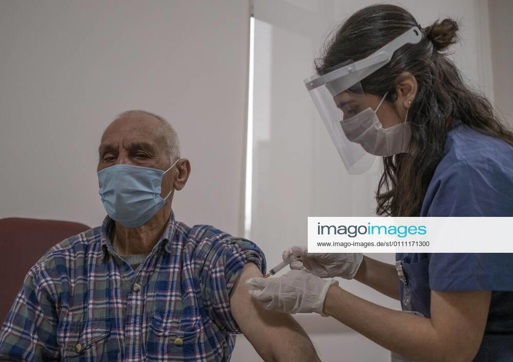 (210127) -- ISTANBUL, Jan. 27, 2021 -- A man receives a dose of COVID-19 vaccine in Istanbul, Turkey, Jan. 27, 2021. A state hospital in Turkey s largest city Istanbul Wednesday was filled with senior citizens who came to be vaccinated against COVID-19 as part of the ongoing mass inoculation program in the country. TO GO WITH Feature: Turkish seniors hope pandemic to end with COVID-19 vaccines (Photo by Xinhua) TURKEY-ISTANBUL-VACCINATION OsmanxOrsal