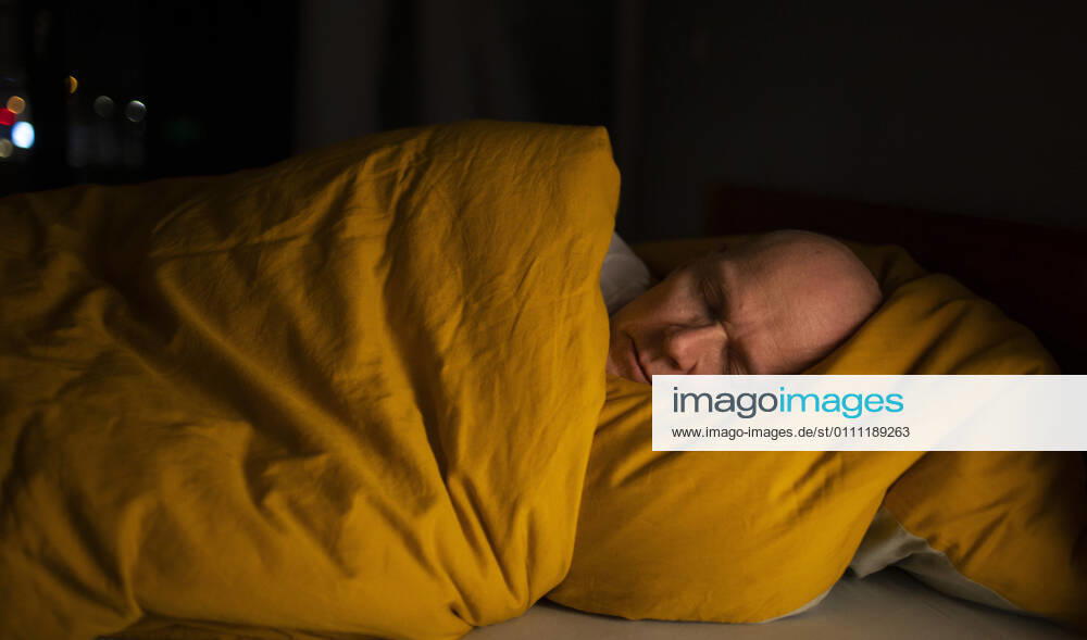 Theme sleep man lies in bed Bonn Germany