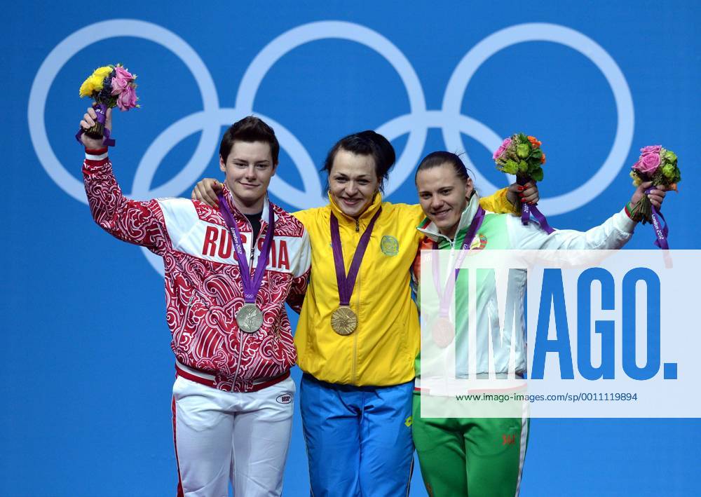 LONDON, Aug. 3, 2012 - Svetlana Podobedova of Kazakhstan (C), silver medalist Natalya Zabolotnaya of Russia (L), and bronze medalist Iryna Kulesha of Belarus celebrate at the awarding ceremony of women s 75kg weightlifting event at London 2012 Olympic Games, London, Britain