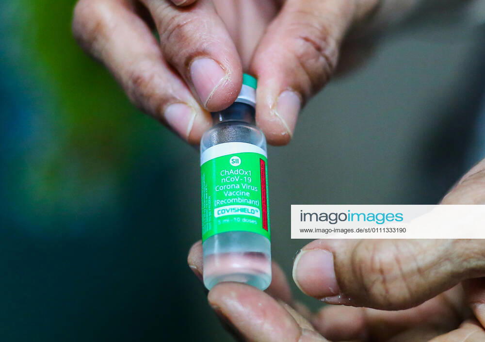 A member of staff poses with a vial of Oxford-AstraZeneca Covid-19 vaccine at The National Hospital Colombo in Sri Lanka on January 29, 2021. Colombo Sri Lanka - ZUMAd152 20210129_znp_d152_003