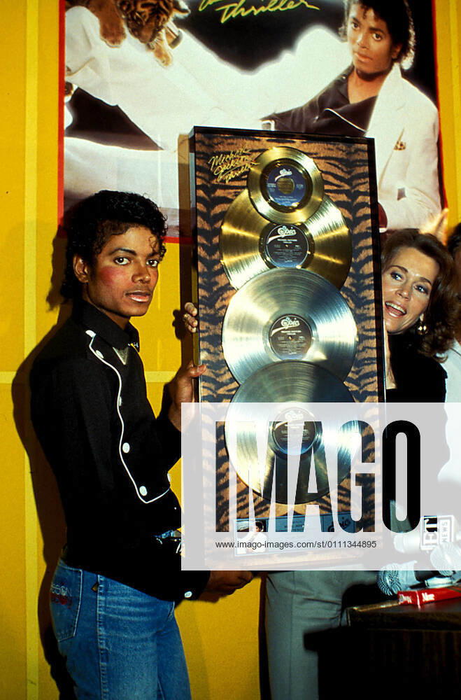 Michael Jackson and Jane Fonda at the Platinum status presentation for his Thriller album on February 25, 1983 1980