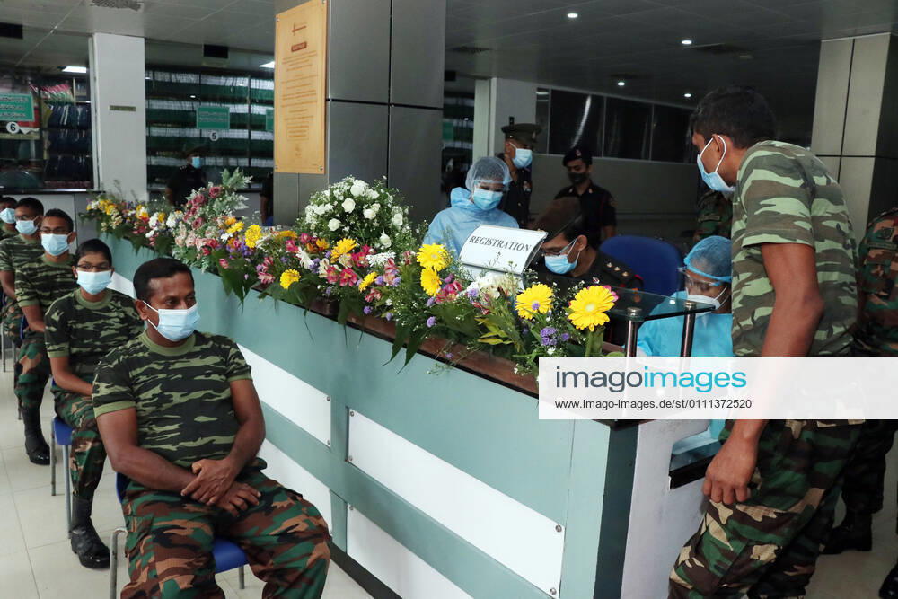 (210129) -- COLOMBO, Jan. 29, 2021 -- Army men wait to get the COVID-19 vaccination at the Army Hospital in Colombo, Sri Lanka, Jan. 29, 2021. Sri Lanka s health officials on Friday kicked off the country s first COVID-19 vaccination program by inoculating a senior consultant physician at the National Infectious Disease Hospital (IDH) who has been in the front lines of the pandemic, local media reported. Dr. Ananda Wijewickrama was the first medical officer to receive the jab on Friday morning, which was monitored by hospital staff and government officials. A senior nurse at the IDH was the second to receive the jab while three military officers also received the jab at the Army Hospital in Colombo. The vaccination program is u
