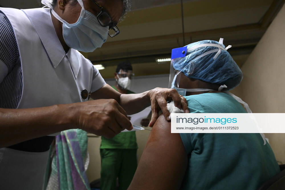 (210129) -- COLOMBO, Jan. 29, 2021 -- A medical worker receives a dose of COVID-19 vaccine at the National Infectious Disease Hospital (IDH) in Colombo, Sri Lanka, Jan. 29, 2021. Sri Lanka s health officials on Friday kicked off the country s first COVID-19 vaccination program by inoculating a senior consultant physician at the National Infectious Disease Hospital (IDH) who has been in the front lines of the pandemic, local media reported. Dr. Ananda Wijewickrama was the first medical officer to receive the jab on Friday morning, which was monitored by hospital staff and government officials. A senior nurse at the IDH was the second to receive the jab while three military officers also received the jab at the Army Hospital in Colom