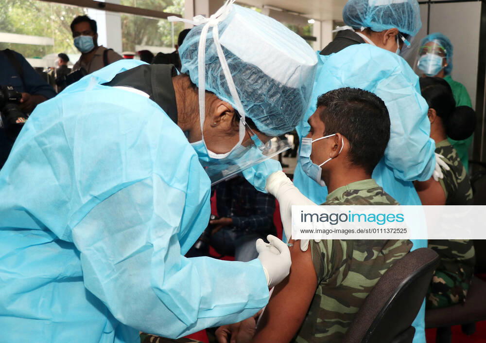 (210129) -- COLOMBO, Jan. 29, 2021 -- An army man gets the COVID-19 vaccination at the Army Hospital in Colombo, Sri Lanka, Jan. 29, 2021. Sri Lanka s health officials on Friday kicked off the country s first COVID-19 vaccination program by inoculating a senior consultant physician at the National Infectious Disease Hospital (IDH) who has been in the front lines of the pandemic, local media reported. Dr. Ananda Wijewickrama was the first medical officer to receive the jab on Friday morning, which was monitored by hospital staff and government officials. A senior nurse at the IDH was the second to receive the jab while three military officers also received the jab at the Army Hospital in Colombo. The vaccination program is under