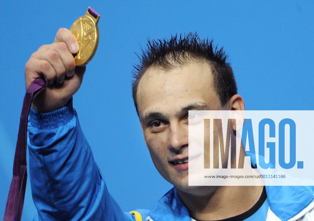 LONDON, GREAT BRITAIN. AUGUST 4, 2012. Ilya Ilyin of Kazakhstan celebrates during the Victory Ceremony after winning gold in the Men s 94kg Weightlifting at the London 2012 Olympic Games. RE104EC0