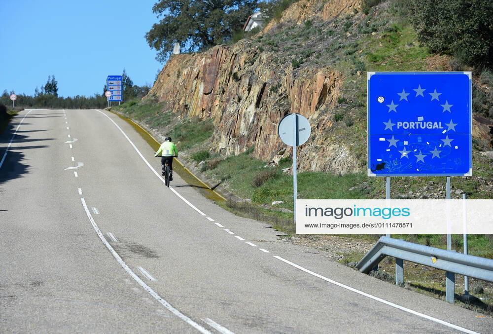 Valverde del Fresno, Spain. Portugal closes land borders. A man riding a bike crosses the land border between Spain and Portugal over the river Torto, in the North-West of Extremadura, this afternoon. From Sunday, Portugal will close its land border with Spain, for a period of at least two weeks in an attempt to contain the coronavirus. In this way, the Portuguese country, will reintroduce police controls along the1,214km border with Spain. However it is understood that essential movements will be still allowed, such for workers, medical reasons and goods s transportation.