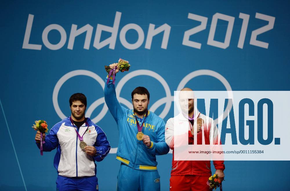(120806) -- LONDON, Aug. 6, 2012 (Xinhua) -- gold medalist Oleksiy Torokhtiy of Ukraine (C), silver medalist Navab Nasirshelal of Iran (L) and bronze medalist Bartlomiej Wojciech Bonk of Poland attend victory ceremony of men s weightlifting 105kg contest, at London 2012 Olympic Games in London, Britain, on August 6, 2012. (Xinhua Tao Xiyi) (nxl) (OLY2012)BRITAIN-LONDON-WEIGHTLIFTING-MEN S 105KG