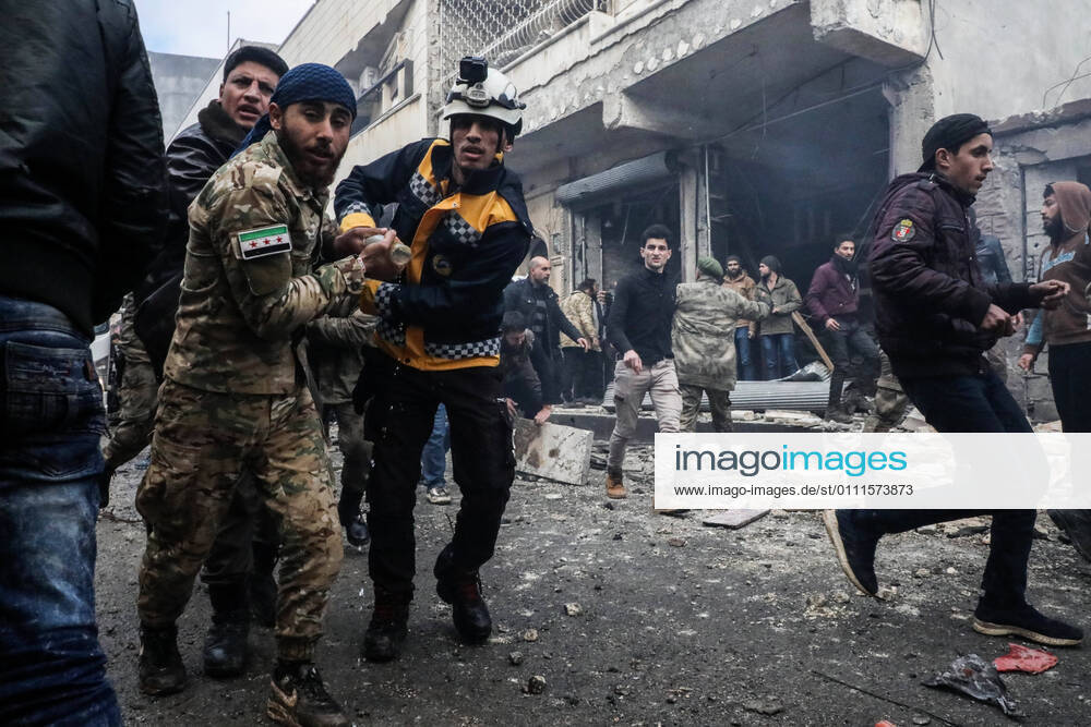 Aleppo, Aleppo, Syrian Arab Republic: Rescue workers carry away a victim at the scene of an explosion in the town of Azaz in the rebel-controlled northern countryside of Syria s Aleppo province, on January 31, 2021. A car bomb killed at least six people, including three civilians, in the Turkish-held northern town of Azaz in war-torn Syria today, a war monitor said. The attack, which occurred near a cultural centre, also wounded more than 22 others, the Britain-based Syrian Observatory for Human Rights said Aleppo Syrian Arab Republic - ZUMAap3_ 20210131_zaf_ap3_028