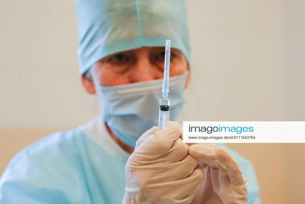 A medical worker prepares a syringe during vaccination with the Gam-COVID-Vak (Sputnik V) vaccine against COVID-19 at Sochi s City Hospital No 4. Dmitry Feoktistov TASS TS0F5AB2