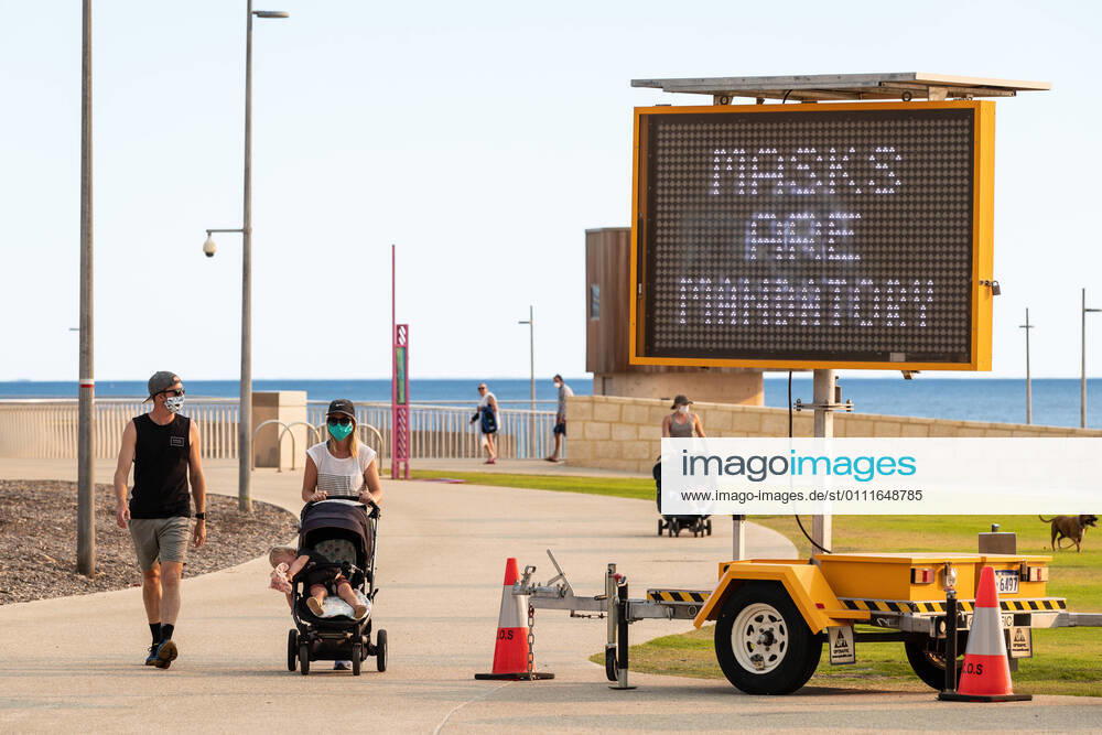WA CORONAVIRUS COVID19, A sign reading, Masks Are Mandatory, is seen at Scarborough beach in Perth, Monday, February 1, 2021. West Australian Premier Mark McGowan yesterday called for a five-day lockdown for metropolitan Perth and two nearby regions after a COVID-19 hotel quarantine breach. ( NO ARCHIVING, , NO USE IN BOOKS WITHOUT CONSENT