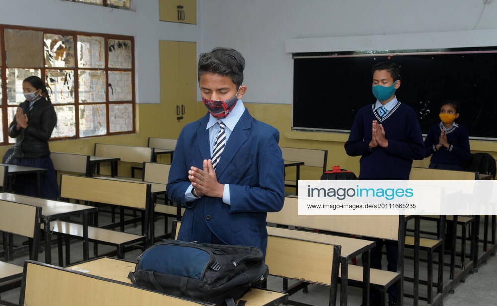 Students attend morning prayers in their classroom after classes resumed for grades 6 to 8 for the first time since the lockdown, at a government school in Sector 50, on February 1, 2021 in Chandigarh, India. (Photo by Ravi Kumar Hindustan Times) Daily Life Amid Covid-19 Pandemic In India