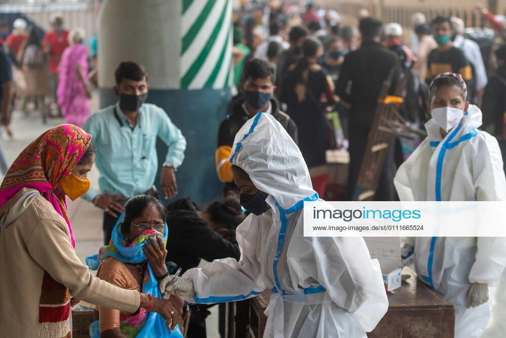 A healthcare worker conducts swab tests of travellers for coronavirus infection, at Dadar station, on February 1, 2021 in Mumbai, India. (Photo by Pratik Chorge Hindustan Times) Daily Life Amid Covid-19 Pandemic In India