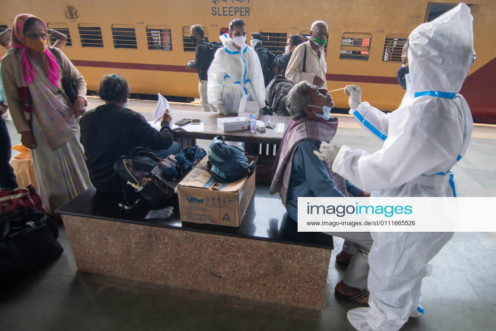 A healthcare worker conducts swab tests of travellers for coronavirus infection, at Dadar station, on February 1, 2021 in Mumbai, India. (Photo by Pratik Chorge Hindustan Times) Daily Life Amid Covid-19 Pandemic In India