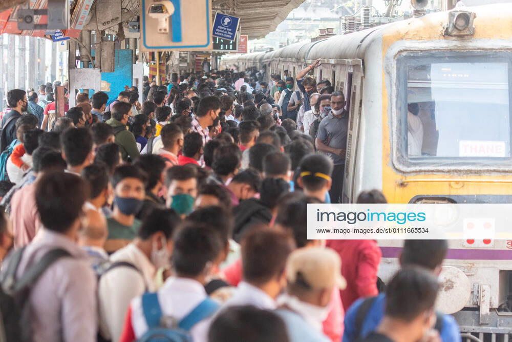 A rush of travellers waiting to board a suburban local train Dadar station on the first day when local train services starts for general public, on February 1, 2021 in Mumbai, India. Travel by local trains, lifeline for millions of people living in Mumbai and surrounding satellite towns, was severely restricted after the coronavirus outbreak in March 2020. (Photo by Pratik Chorge Hindustan Times) Mumbai Local Trains Resume Services For General Public