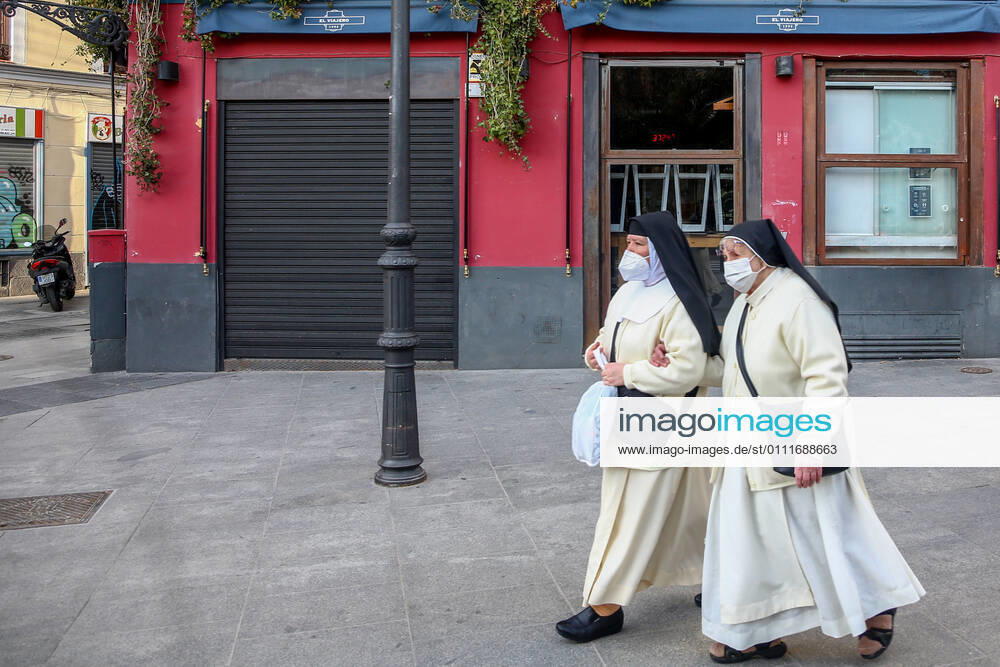 Two nuns pass by a closed restaurant in the district of La Latina in Madrid (Spain), on February 1, 2021. The community of Madrid will decree the mandatory use of masks inside restaurants and increase the number of people who can be seated at the same table on a terrace to 6. The measures will come into force from next Friday. 01 FEBRUARY 2021;CORONAVIRUS;RESTRICTIONS;INFECTED;CONTAGIONS;MASKS;HOSPITALITY INDUSTRY Ricardo Rubio LagenciaEP 02 01 2021 Madrid Madrid Spain