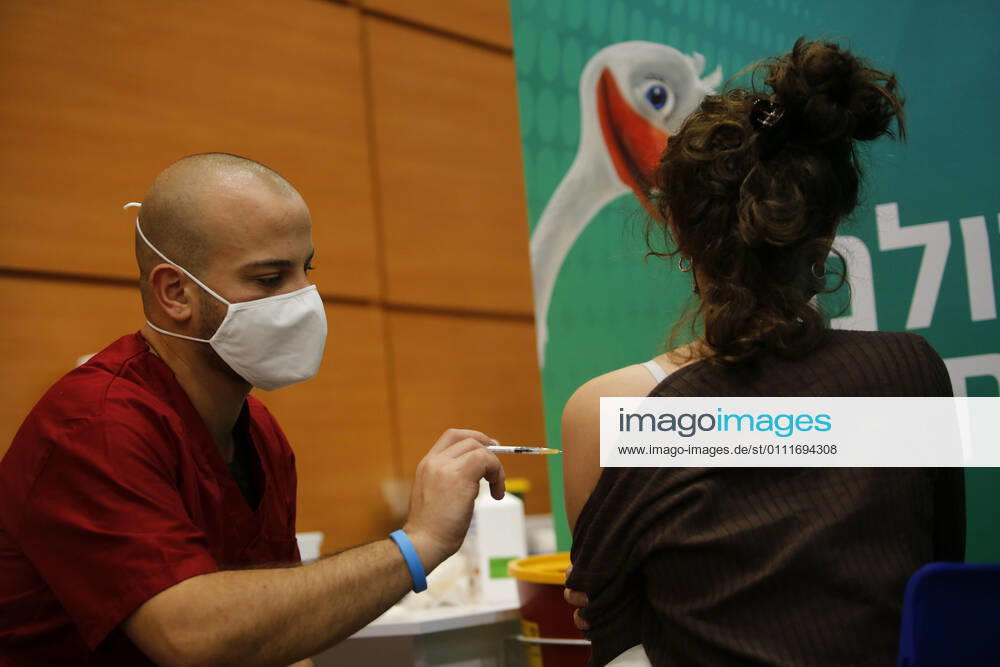 (210201) -- TEL AVIV, Feb. 1, 2021 -- A woman receives the COVID-19 vaccine at a health service center in Tel Aviv, Israel, on Feb. 1, 2021. Israel s Ministry of Health reported 8,399 new COVID-19 cases on Monday, bringing the tally in the country to 651,405. The number of people vaccinated against the COVID-19 in Israel has surpassed 3.14 million, or 33.8 percent of its total population, since the vaccination campaign began on Dec. 20, 2020. (Photo by Xinhua) ISRAEL-TEL AVIV-COVID-19-VACCINATION GilxCohenxMagen