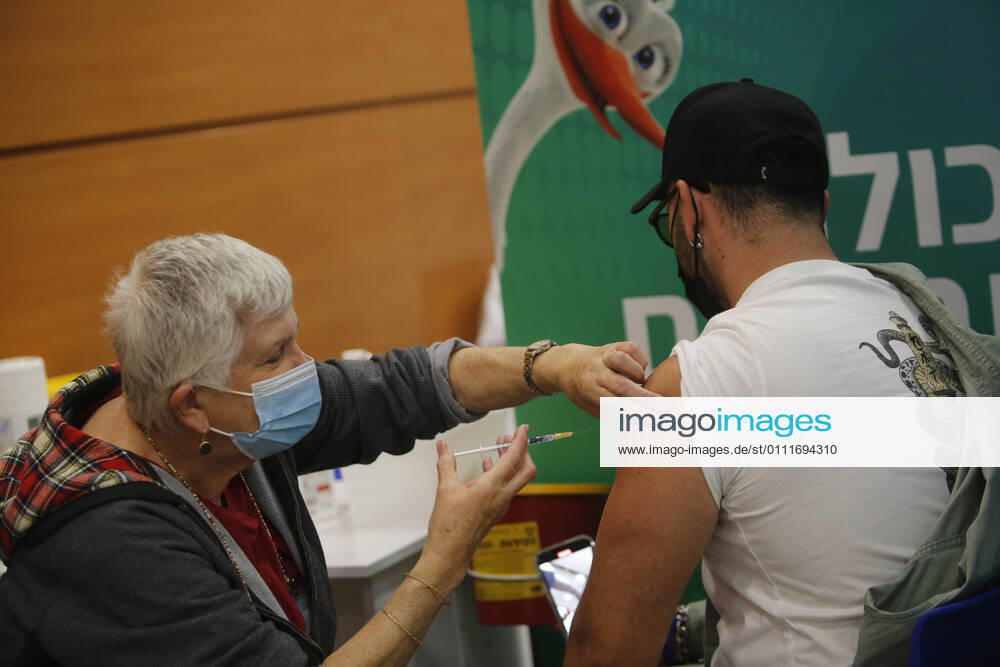 (210201) -- TEL AVIV, Feb. 1, 2021 -- A man receives the COVID-19 vaccine at a health service center in Tel Aviv, Israel, on Feb. 1, 2021. Israel s Ministry of Health reported 8,399 new COVID-19 cases on Monday, bringing the tally in the country to 651,405. The number of people vaccinated against the COVID-19 in Israel has surpassed 3.14 million, or 33.8 percent of its total population, since the vaccination campaign began on Dec. 20, 2020. (Photo by Xinhua) ISRAEL-TEL AVIV-COVID-19-VACCINATION GilxCohenxMagen