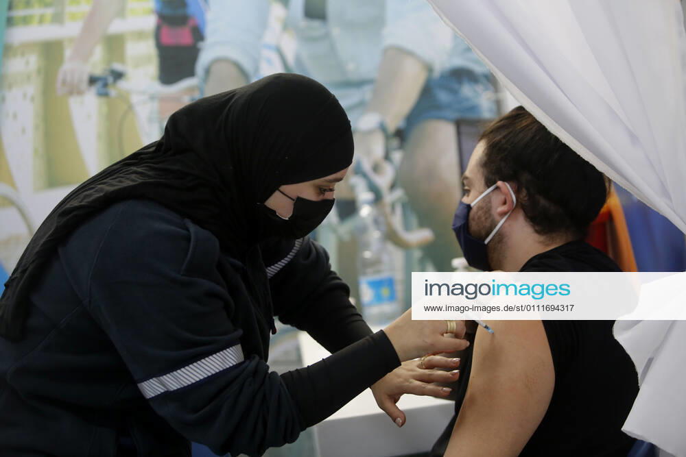 (210201) -- TEL AVIV, Feb. 1, 2021 -- A man receives the COVID-19 vaccine at a health service center in Tel Aviv, Israel, on Feb. 1, 2021. Israel s Ministry of Health reported 8,399 new COVID-19 cases on Monday, bringing the tally in the country to 651,405. The number of people vaccinated against the COVID-19 in Israel has surpassed 3.14 million, or 33.8 percent of its total population, since the vaccination campaign began on Dec. 20, 2020. (Photo by Xinhua) ISRAEL-TEL AVIV-COVID-19-VACCINATION GilxCohenxMagen