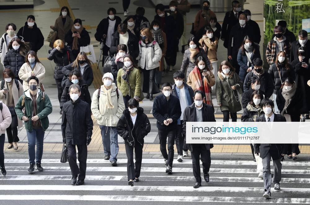Japan to extend virus emergency to March 7 as hospitals strained People wearing face masks walk in front of JR Osaka Station on Feb. 2, 2021. The Japanese government is set to extend a coronavirus state of emergency for Tokyo, Osaka and other regions by one month to March 7 in view of manpower-strapped hospitals amid a surge in serious patients.