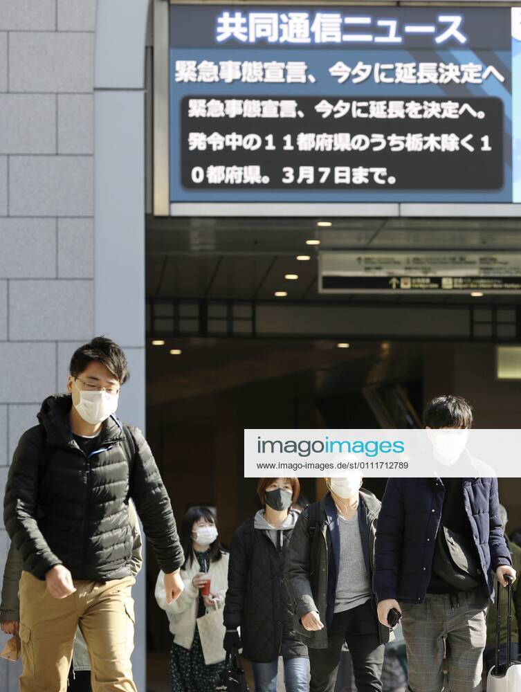 Japan to extend virus emergency to March 7 as hospitals strained People wearing face masks walk in front of JR Osaka Station on Feb. 2, 2021. The Japanese government is set to extend a coronavirus state of emergency for Tokyo, Osaka and other regions by one month to March 7 in view of manpower-strapped hospitals amid a surge in serious patients.