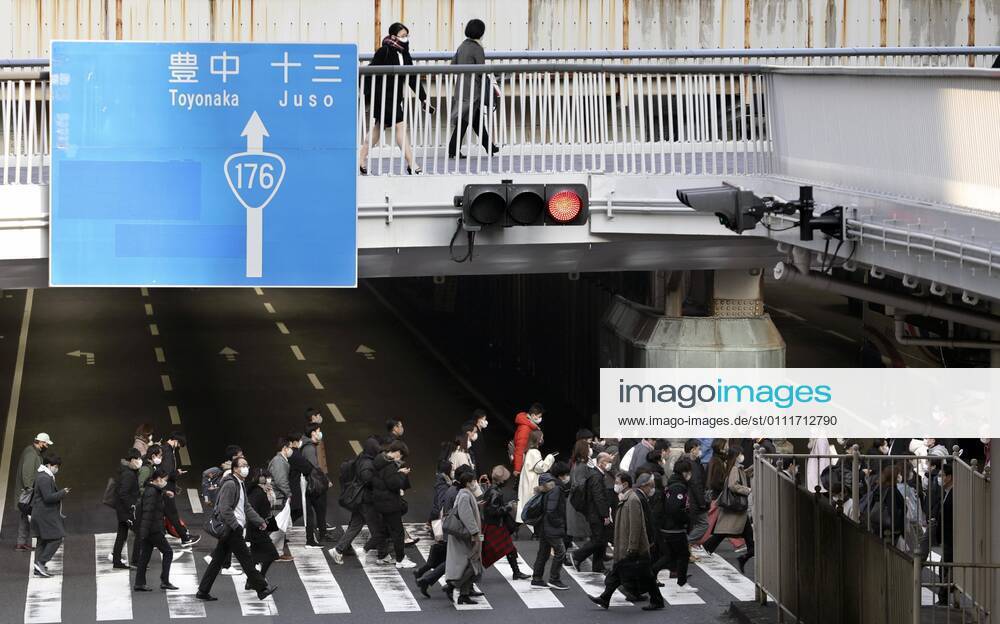 Japan to extend virus emergency to March 7 as hospitals strained People wearing face masks walk in front of JR Osaka Station on Feb. 2, 2021. The Japanese government is set to extend a coronavirus state of emergency for Tokyo, Osaka and other regions by one month to March 7 in view of manpower-strapped hospitals amid a surge in serious patients.