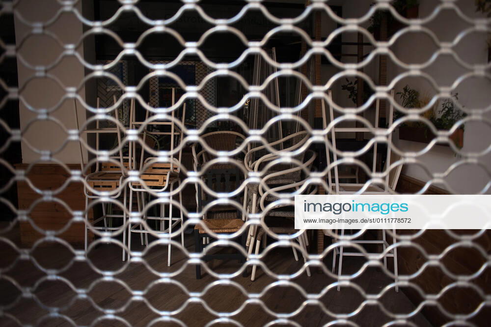 Chairs stacked inside Volapie closed bar during the closure of the hospitality sector and non-essential activities as part of a partial lockdown..For two weeks, besides the limit on mobility between cities, many municipalities and Costa del Sol districts (including the Malaga capital) will have to close bars, restaurants and stores as measures to curb the spread of the coronavirus pandemic. In the lead of Andalusia, Malaga is the city with more daily coronavirus infections and a high rate of hospitalizations. Malaga Spain - ZUMAs197 20210202_zab_s197_013