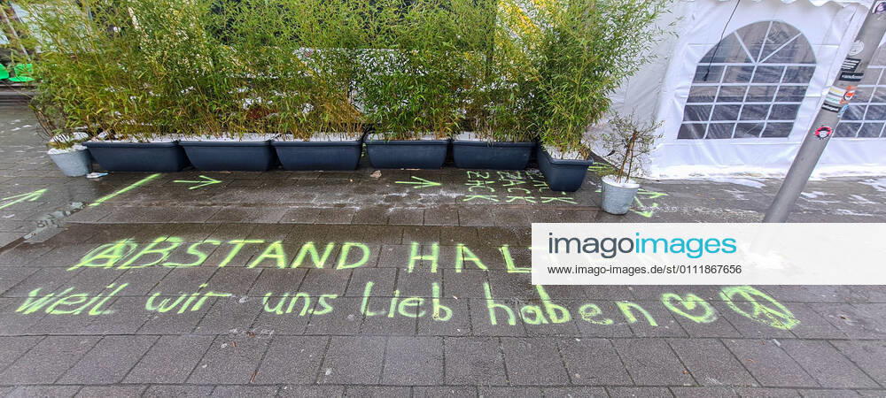 Hamburg in Corona Lockdown Scenes in February 2021 around the Hamburger Außenalster Writing Keep distance in front of a restaurant in Hamburg Winterhude Hamburg in Corona Lockdown Scenes in February 2021 around the Hamburger Außenalster , Hamburg Hamburg Germany Downtown around the Alster