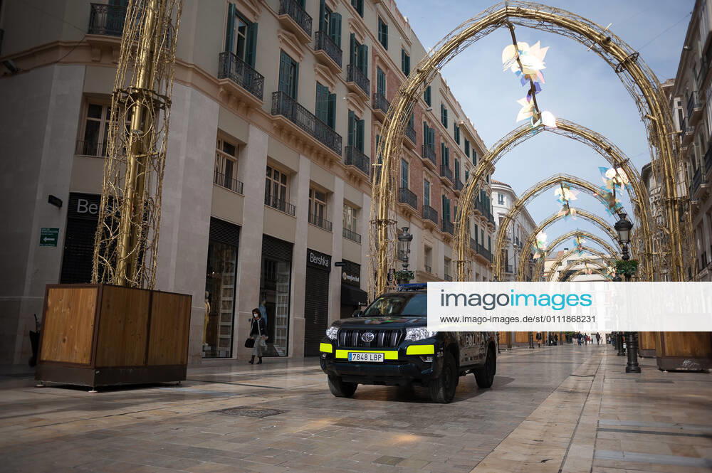 A police car seen patrolling at an empty and deserted Marques de Larios street amid the partial lockdown caused by coronavirus pandemic. Malaga Spain - ZUMAs197 20210203_zab_s197_016
