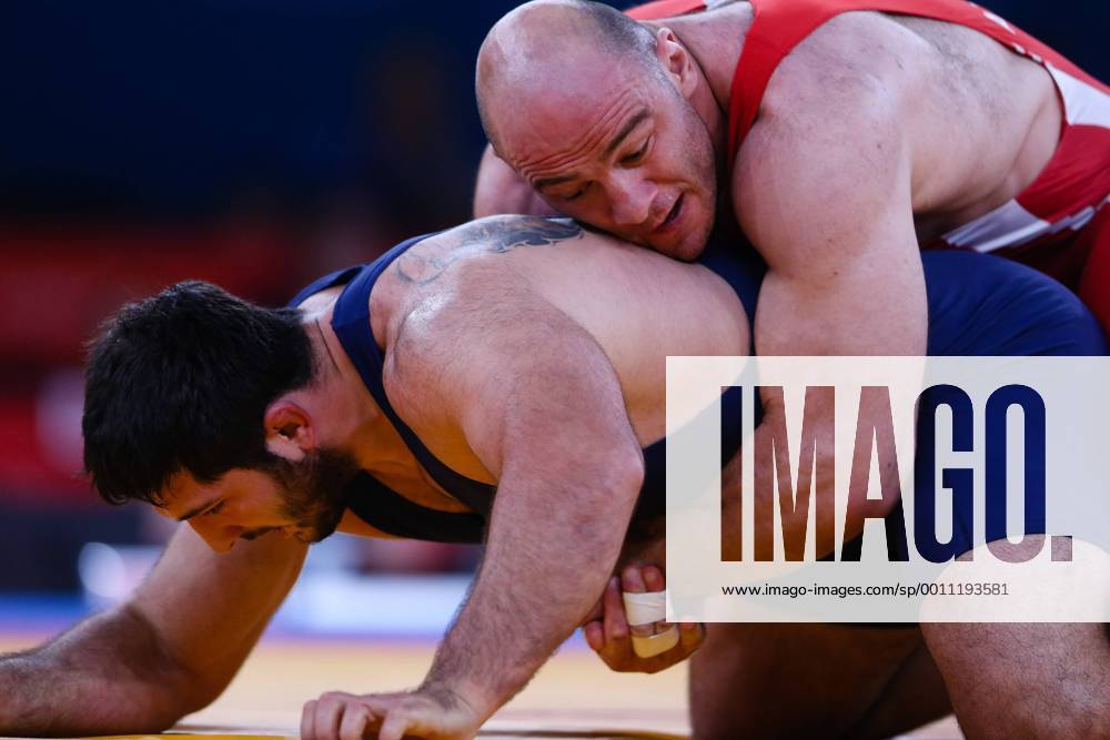 (120811) -- LONDON, Aug. 11, 2012 (Xinhua) -- Artur Taymazov of Uzbekistan (red) competes with Davit Modzmanashvili of Georgia during the Men s 120kg Freestyle gold medal match of Wrestling at London 2012 Olympic Games, London, Britain, Aug. 11, 2012. Artur Taymazov of Uzbekistan won the match and claimed the gold medal of the event. (Xinhua Jin Liwang) (OLY2012)BRITAIN-LONDON-WRESTLING-MEN-60KG