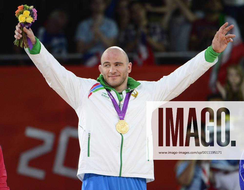 Artur Taymazov of Uzbekistan acknowledges the cheers of the crowd after receiving the Gold Medal for his victory over over Davit Modzmanashvili of Georgia in the Men s 120kg Freestyle Wrestling at the London 2012 Summer Olympics on August 10, 2012 in London. OLY20120811305