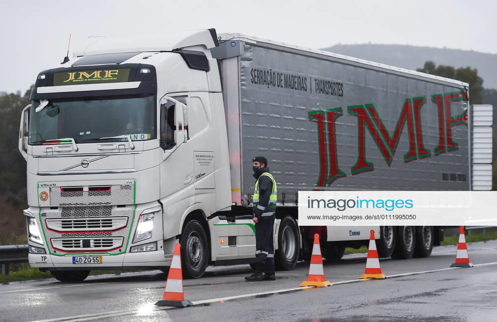 A Portuguese Republican National Guard officer (GNR), stops a truck at the border between Portugal and Spain..Since January 31, Portugal closed its land border with Spain, for a period of at least two weeks in an attempt to contain the virus. Just essential movements are still allowed, such for workers, medical reasons and goods transportation. Monfortinho Portugal - ZUMAs197 20210204_zaa_s197_170