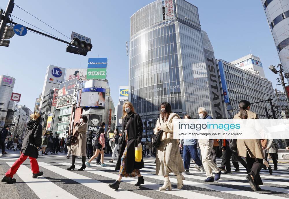 Coronavirus cases top 400,000 in Japan People wearing face masks to protect against the novel coronavirus walk in Tokyo s Shibuya area on Feb. 5, 2021. The cumulative number of coronavirus cases in Japan exceeded 400,000 the same day.
