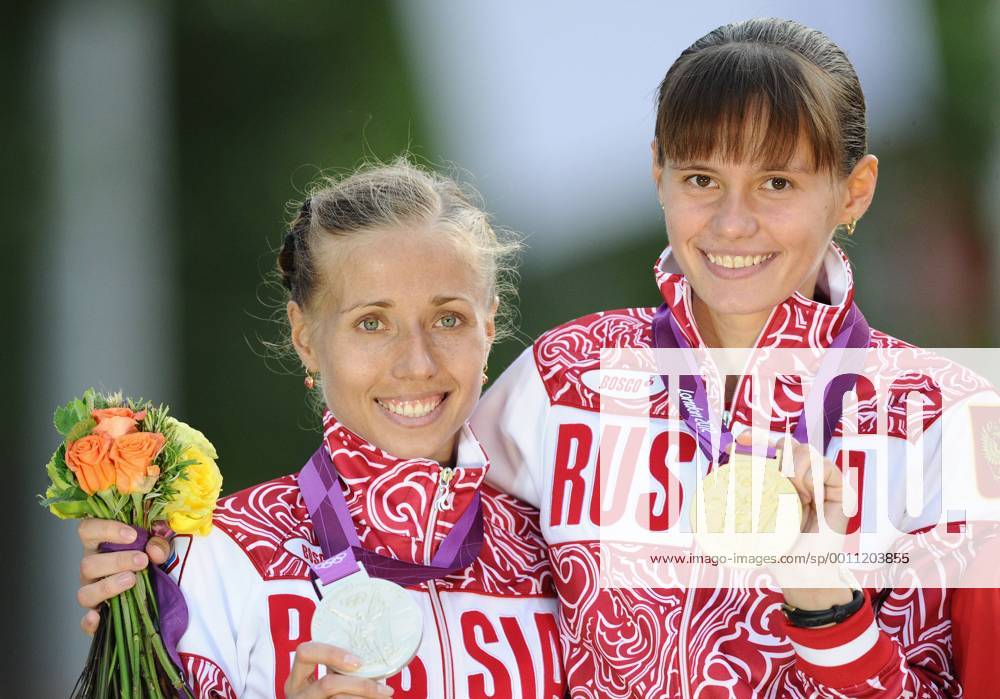 LONDON, GREAT BRITAIN. AUGUST 11, 2012. Russia s Olga Kaniskina (silver), left, and Elena Lashmanova (gold) pictured during the Victory Ceremony after winning the women s 20km race walk at the London 2012 Olympic Games. RE105AC7