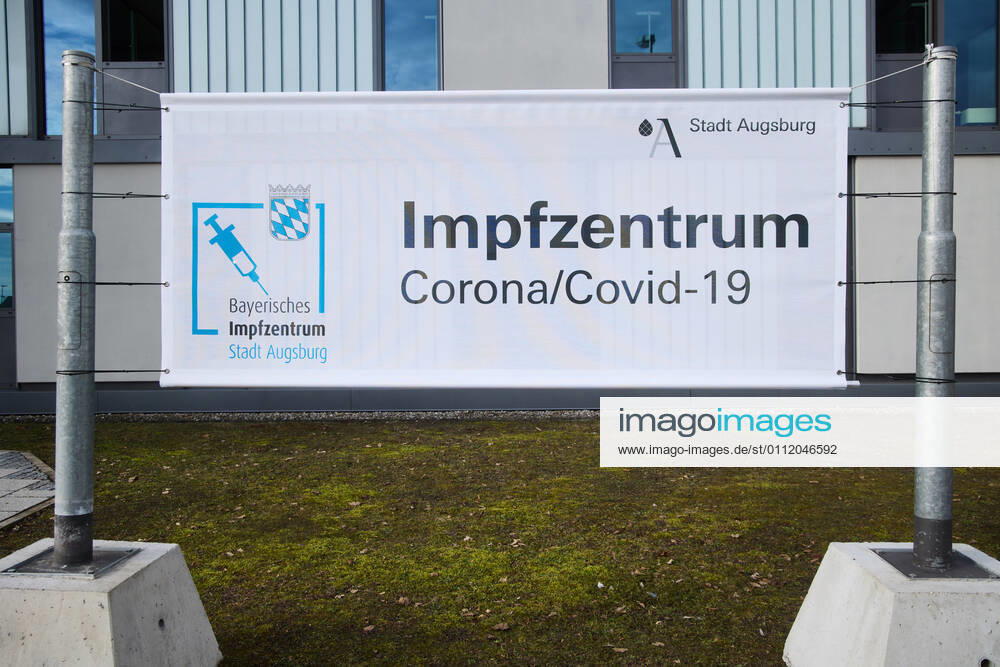 Guilt, banner in front of the vaccination centre Bavarian Vaccination Centre Augsburg, press tour Bavarian Vaccination Centre Augsburg, press tour