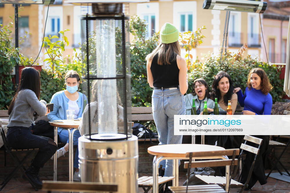Several people on a terrace of the bar El Viajero , in the neighborhood of La Latina, in Madrid (Spain), on February 5, 2021. Since Tuesday, a plaque pays tribute to the bar El Viajero , in La Latina, representing all the anonymous cafes and bars that are fragments of the history of Madrid , in the words of the delegate of Culture, Tourism and Sport Andrea Levy. 5 FEBRUARY 2021;THE TRAVELLER;LA LATINA;MADRID;HOTEL AND CATERING;CAFE;BAR;CATERING Tamara Rozas LagenciaEP 02 05 2021 MADRID MADRID Spain