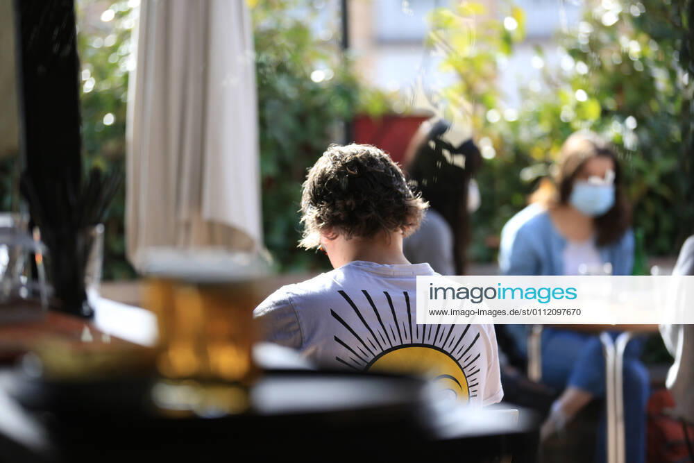 Several people on a terrace of the bar El Viajero , in the neighborhood of La Latina, in Madrid (Spain), on February 5, 2021. Since Tuesday, a plaque pays tribute to the bar El Viajero , in La Latina, representing all the anonymous cafes and bars that are fragments of the history of Madrid , in the words of the delegate of Culture, Tourism and Sport Andrea Levy. 5 FEBRUARY 2021;THE TRAVELLER;LA LATINA;MADRID;HOTEL AND CATERING;CAFE;BAR;CATERING Tamara Rozas LagenciaEP 02 05 2021 MADRID MADRID Spain
