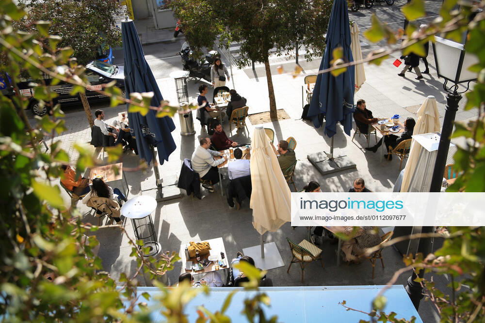 Several people on the terrace of a bar in the center of Madrid (Spain), on February 5, 2021. The Community of Madrid extends from Friday the number of people who can share a table on the terraces, which goes from four to a maximum of six, while maintaining the limit of four inside the establishments, and continues to suspend the bar service. The increase in the maximum number of diners on the terraces has been published Friday in the Official Gazette of the Community of Madrid (BOCM) with effect from the same day of publication. 5 FEBRUARY 2021;COMMUNITY OF MADRID;HOSPITALITY;CORONAVIRUS;TERRACES;BARS;ECONOMY;VIRUS Tamara Rozas LagenciaEP 02 05 2021 MADRID MADRID Spain