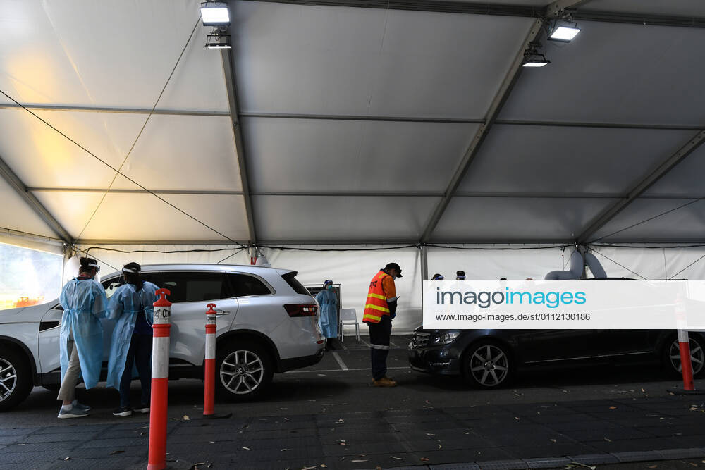 VICTORIA CORONAVIRUS COVID19, **EDS NOTE - IMAGE HAS BEEN DIGITALLY ALTERED TO BLUR LICENCE PLATE** Medical staff work at a pop-up Covid-19 testing site in Brighton, Melbourne, Saturday, February 6, 2021. Victoria will review airflow within quarantine hotels and change mask policies for staff as it seeks to avoid a repeat of two suspected COVID-19 leaks. ( NO ARCHIVING, , NO USE IN BOOKS WITHOUT CONSENT MELBOURNE VIC AUSTRALIA
