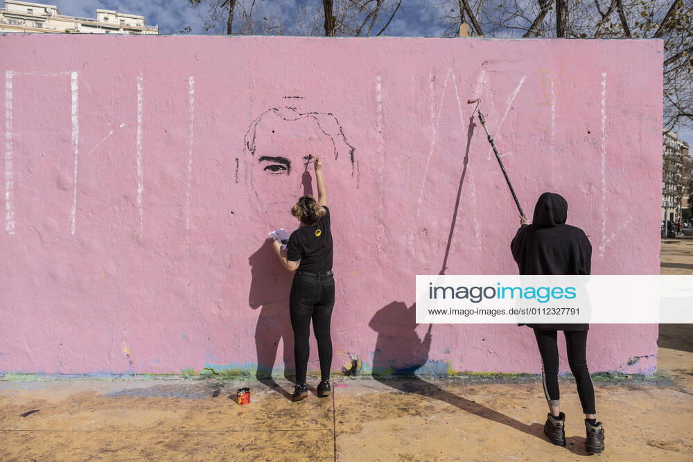 Artists are seen painting a graffiti with a portrait of Pablo Hasel on one of the walls at the Les Tres Ximeneies gardens..Artists have painted various murals at the Tres Xemeneies gardens to demand the freedom of the rapper and poet Pablo Hasel sentenced to nine months in prison accused of crimes of insults against the crown and institutions and glorification of terrorism derived from the lyrics of his songs. Barcelona Spain - ZUMAs197 20210207_zaa_s197_261