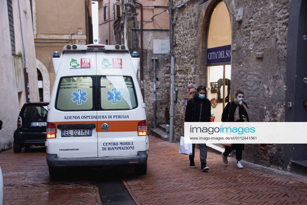 Perugia in the red zone. The capital and the province in full state of emergency covid 19 also due to the variants of the virus present in the area. the city is back in full lockdown. the deserted historic center. anguish and fear reign. an ambulance with lights and sirens on in via Oberdan. an amulance with the lights on in via oberdan. Editorial Usage Only