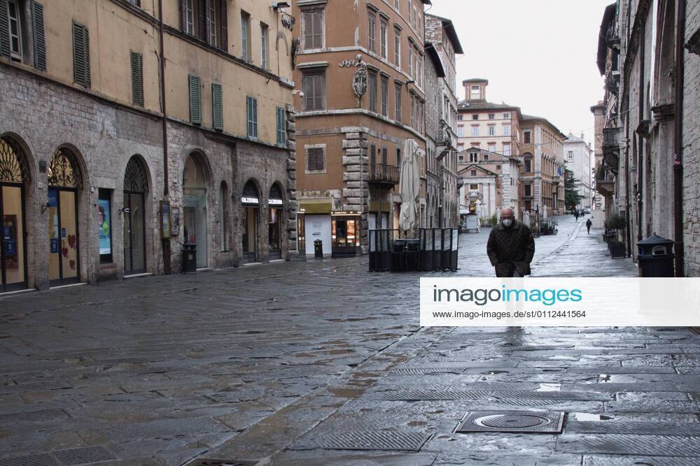 Perugia in the red zone. The capital and the province in full state of emergency covid 19 also due to the variants of the virus present in the area. the city is back in full lockdown. the deserted historic center. anguish and fear reign. Corso Vannucci Editorial Usage Only