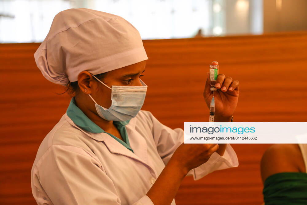 Bangladesh: Covid-19 vaccination drive begins in Dhaka A medical worker preparing a syringe and an ampule with the dose of Covishield covid-19 vaccine during the vaccination drive. Dhaka Dhaka Division Bangladesh