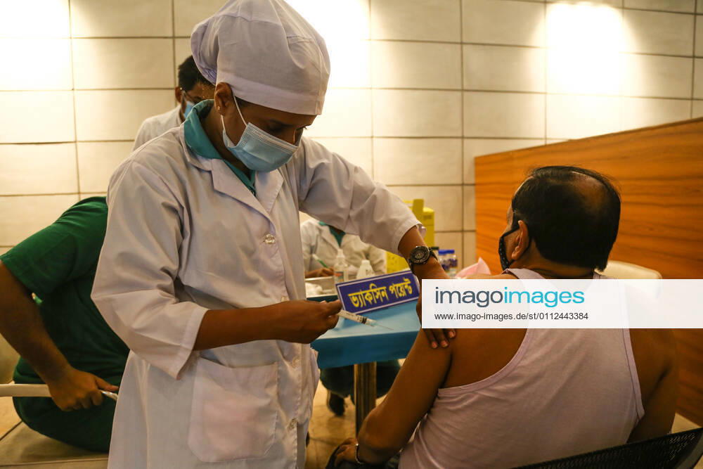Bangladesh: Covid-19 vaccination drive begins in Dhaka A man getting a shot with the dose of Covishield covid-19 vaccine during the vaccination drive. Dhaka Dhaka Division Bangladesh