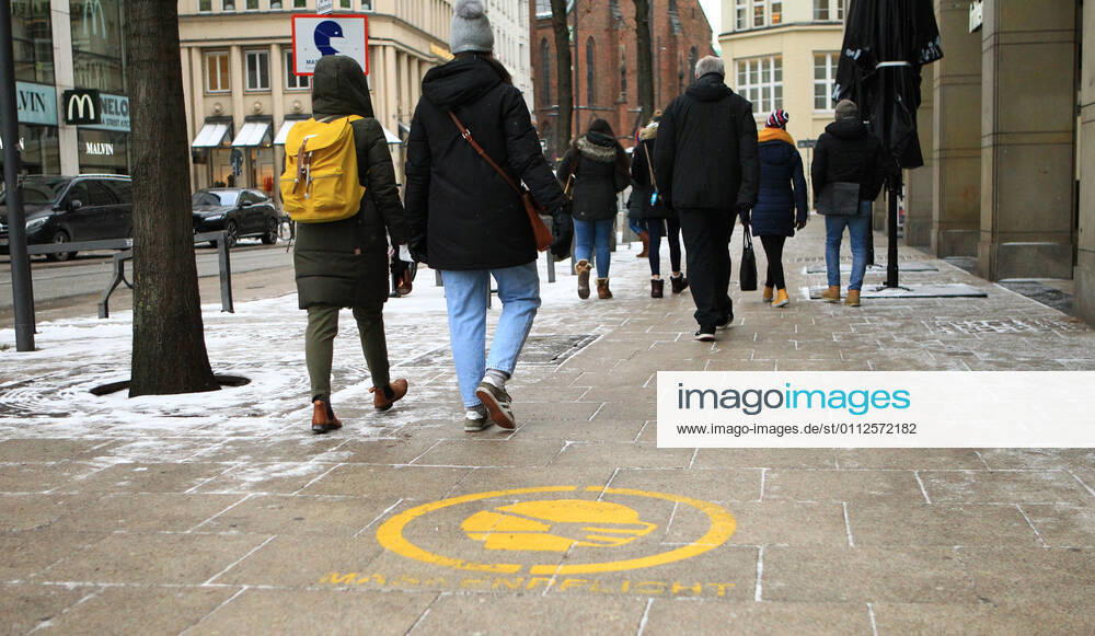 A notice has been spray-painted on the pavement slabs in Hamburgs city centre that masks are compulsory City centre Hamburg