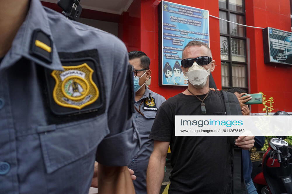 DAVID TAYLOR (right) escorted by an Immigration Officer. DAVID TAYLOR, also known as DJ NUTZO , British citizen who killed a Bali Policeman WAYAN SUDIARSA in 2016 freed after jailed for 5 years in Kerobokan Prison. His girlfriend, SARA CONNOR, which both are sentenced for fatal group assault has been freed on July 2020. Badung Indonesia - ZUMAb245 20210210_zip_b245_003