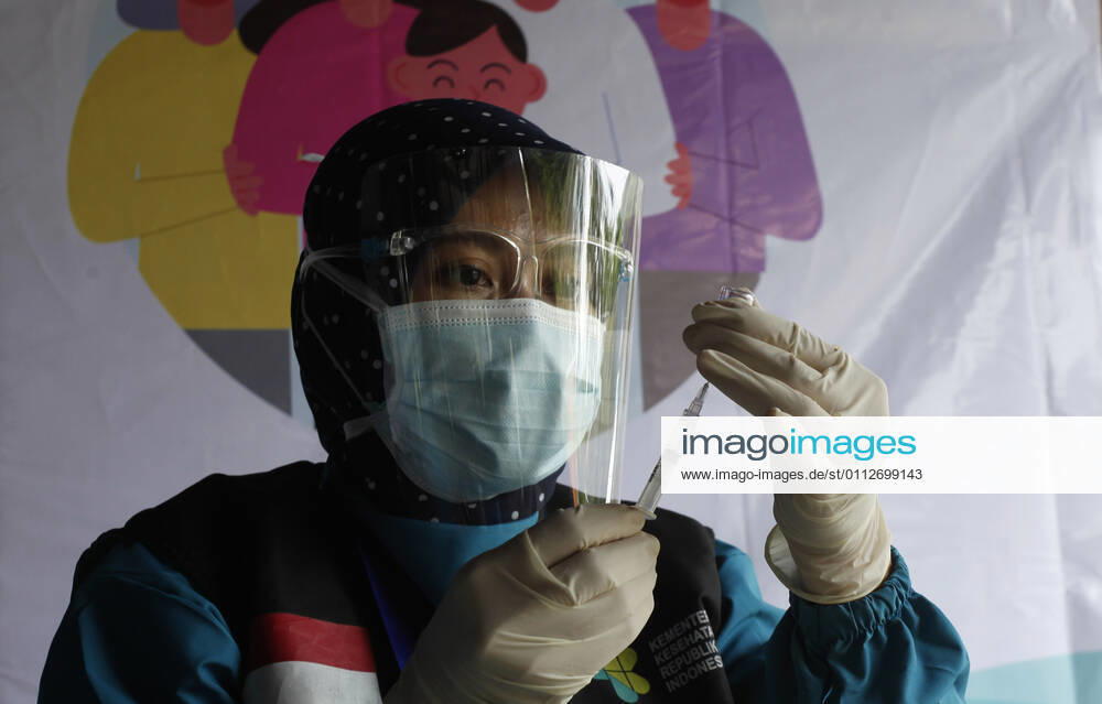 Indonesia s COVID-19 Mass Vaccination A health worker prepares a SinoVac COVID-19 vaccine during a mass vaccination for medical workers and elderly people in Bogor, West Java on February 11, 2021. (Photo by Adrian INA Photo Agency)