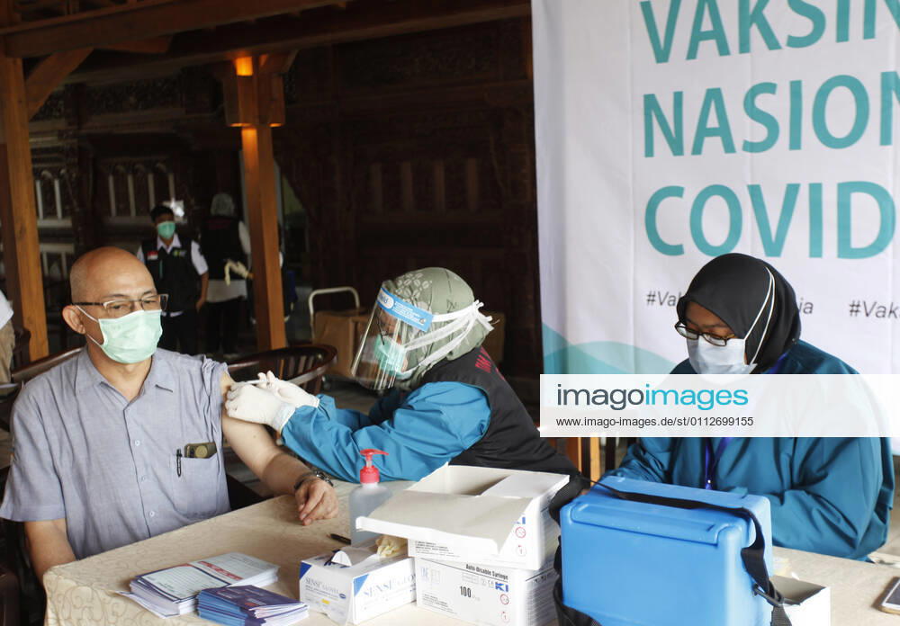Indonesia s COVID-19 Mass Vaccination A health worker vaccinates elderly health workers during COVID-19 mass vaccination for medical workers and elderly people in Bogor, West Java on February 11, 2021. (Photo by Adrian INA Photo Agency)