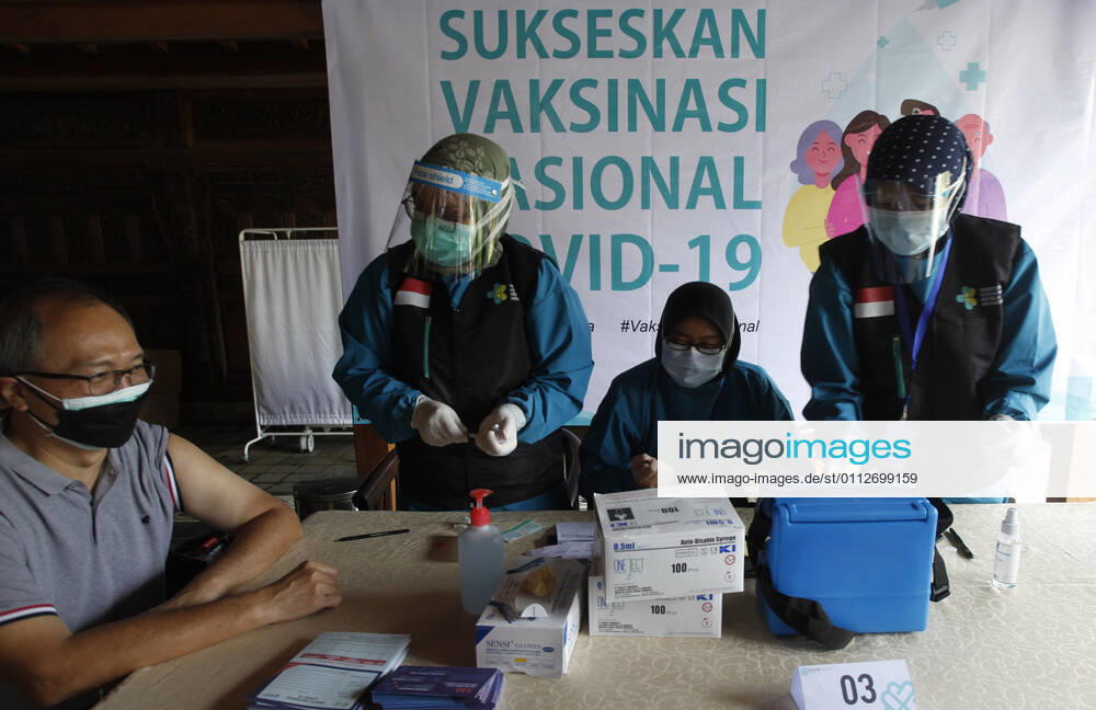 Indonesia s COVID-19 Mass Vaccination A health worker vaccinates elderly health workers during COVID-19 mass vaccination for medical workers and elderly people in Bogor, West Java on February 11, 2021. (Photo by Adrian INA Photo Agency)