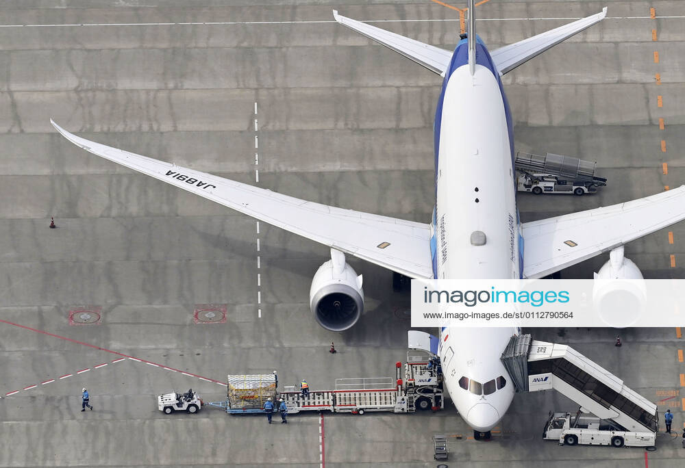 1st batch of Pfizer COVID-19 vaccine arrives in Japan Photo taken from a Kyodo News helicopter on Feb. 12, 2021, shows cargo being unloaded at Narita airport near Tokyo from an airplane that transported from Brussels the first batch to arrive in Japan of the coronavirus vaccine developed by U.S. pharmaceutical giant Pfizer Inc.